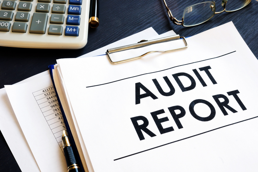 Audit report with business documents in an office.